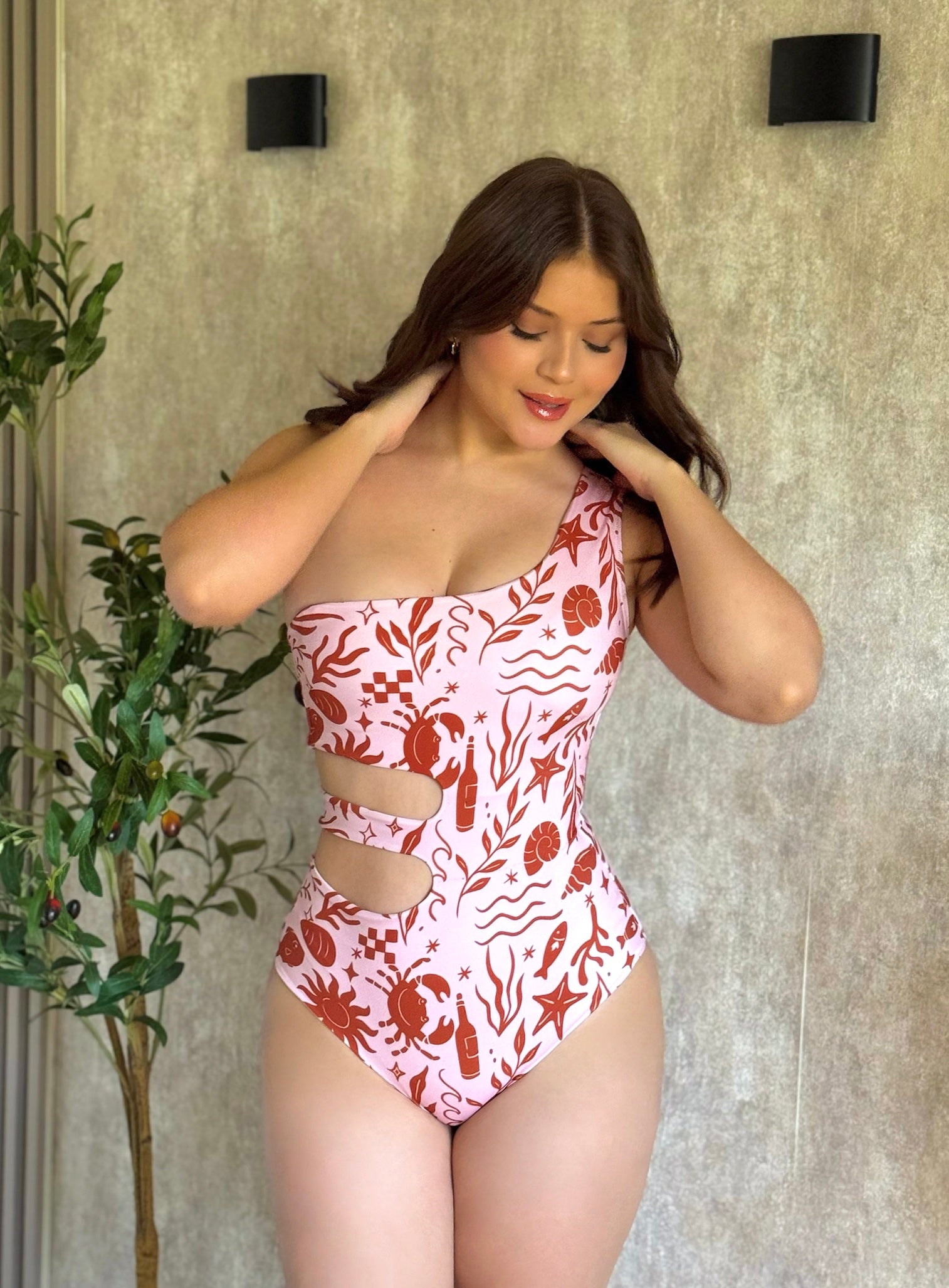 Traje de baño enterizo medio beso print naranja